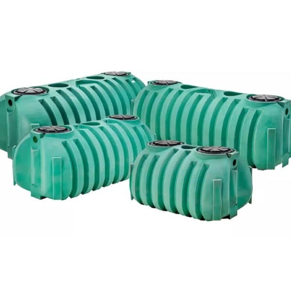The image shows NexGen D2 septic tanks in various sizes and green colors.