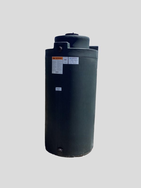 The image shows a green vertical water storage tank.